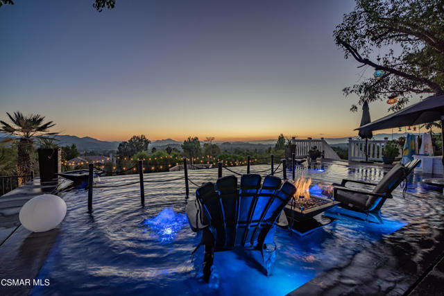 Situated on 12.5 private acres, Windrose Ranch boasts 260 degree views of the Thousand Oaks rolling hills backed by the picturesque Santa Monica Mountains to the west. Tucked away yet city close, this private rancho features a 2400+ square foot single story home that opens up to the state of the art, stunning infinity edge pool accented by mature oaks and indigenous foliage creating an experience that invites you to linger.This property is truly magical. The Primary Residence is nestled behind a private gate with long driveway and plenty of privacy. Complete with terraces for dining and dreaming. From avocado orchards to the possibility of your own vineyard. Play is a major focus on the grounds. Saddle up your favorite steed or collect eggs for the morning breakfast. You can even practice your short game with friends on the putting green.Property owner has plans & permits approved for a massive remodel and addition. Additional plans prepared to subdivide the 12 plus acres with possibility for development of up to 7-9 lots. Come experience the possibilities at Windrose Ranch.