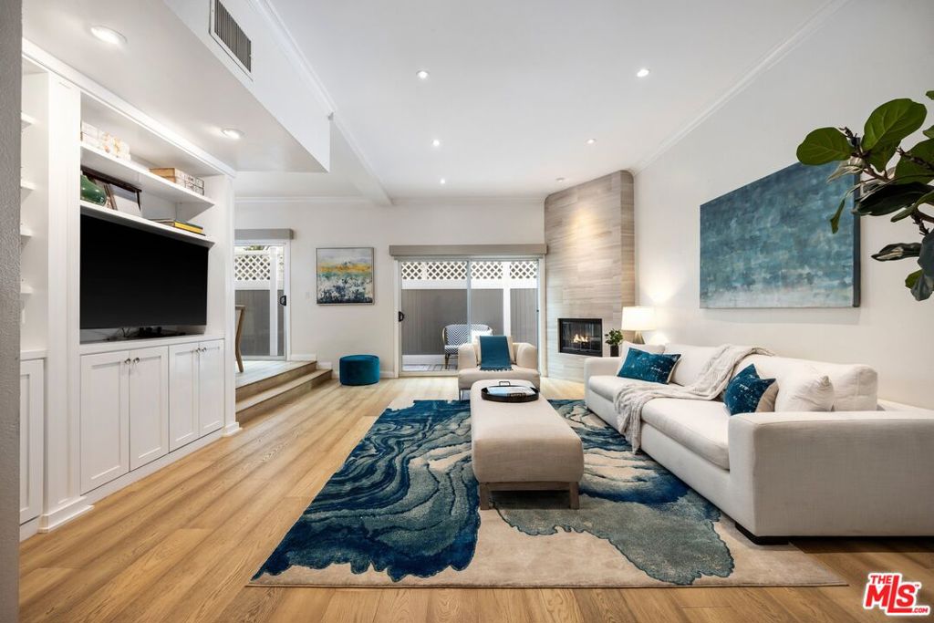 Located in the heart of Santa Monica with easy access to shopping, world class restaurants, and the beach, this townhome style condo has been updated with a focus on style and modern elegance. The spacious living room features a fireplace and lovely built-ins. The gourmet kitchen has stainless steel appliances, ample counter space and storage for the most discriminating chef. Up a flight of stairs to the primary suite which accommodates a Ca King bed, has a walk-in closet and a luxurious bath with separate shower and tub. The second bedroom has a walk-in closet. There is washer/dryer in the unit and 2 car tandem parking in a secure community garage. Don't miss this opportunity to enjoy the SM California lifestyle.
