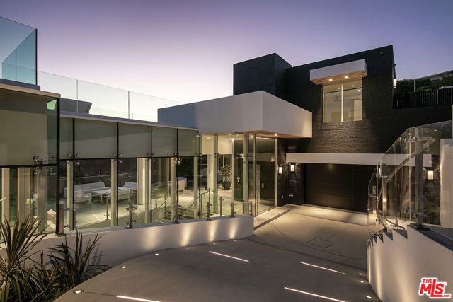 1615 BLUE JAY Way Los Angeles, California "Touch the Sky". Epic view modern compound on world-famous Blue Jay Way. Brand new 2020 construction. Approx. 11,500sqft with massive 3,000sqft pool deck and zero edge infinity pool. Walls of glass open to reveal panoramic jetliner views. Private gated driveway lead to glamorous arrival motor court. Beyond is a 3-story glass atrium in the style of an Apple store, wow on every level. Main entertaining level encompasses living room, dining room and a show kitchen designed by Dada complete with walk-in refrigerator and hidden catering kitchen. Grand Master suite with a closet to rival any major estate in the city. Additional living amenities include: wellness center with gym, juice bar and massage, screening room, commercial elevator, 2 offices and a total of 5 bedrooms. Architectural features include: Fleetwood doors throughout, closets by Molteni, Dornbracht fixtures and solid concrete construction. Years in the making... once in a generation opportunity.