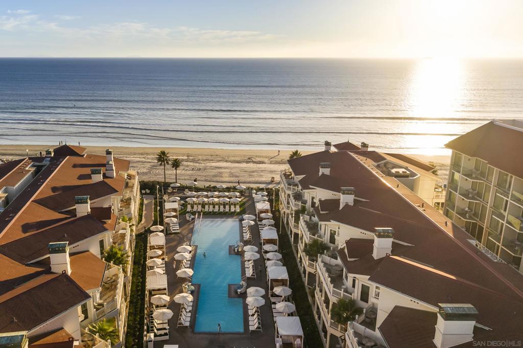 Experience the epitome of coastal luxury at Shore House at The Del, where oceanfront living along Coronado’s iconic coastline is reimagined with elegance and ease. This beautifully appointed 2-bedroom, 2-bath residence includes the option to transfer a Del Resort Membership with purchase at list price (subject to application and transfer fee), offering enhanced access to exclusive amenities.  The residence features a spacious open floor plan filled with natural light and offers sweeping, unobstructed views of both the Pacific Ocean and Glorietta Bay. The chef-inspired kitchen is equipped with top-tier appliances, ideal for everyday living or entertaining. Floor-to-ceiling windows in the expansive living area bring the serene coastal landscape indoors, while the oversized balcony invites you to relax in the ocean breeze—perfect for morning coffee or a peaceful evening unwind.  Ownership includes access to The Del’s world-class amenities: a five-star spa, state-of-the-art fitness center, fine dining, and more—just steps from your front door. This is Full Ownership with Limited Use, combining personal enjoyment with strong rental performance.  A rare opportunity to own in one of California’s most iconic coastal destinations.  An extraordinary opportunity to own in one of California’s most prestigious coastal destinations.  Experience the epitome of coastal luxury at Shore House at The Del, where oceanfront living along Coronado’s iconic coastline is reimagined with elegance and ease. This beautifully appointed 2-bedroom, 2-bath residence includes the option to transfer a Del Resort Membership with purchase at list price (subject to application and transfer fee), offering enhanced access to exclusive amenities.  The residence features a spacious open floor plan filled with natural light and offers sweeping, unobstructed views of both the Pacific Ocean and Glorietta Bay. The chef-inspired kitchen is equipped with top-tier appliances, ideal for everyday living or entertaining. Floor-to-ceiling windows in the expansive living area bring the serene coastal landscape indoors, while the oversized balcony invites you to relax in the ocean breeze—perfect for morning coffee or a peaceful evening unwind.  Ownership includes access to The Del’s world-class amenities: a five-star spa, state-of-the-art fitness center, fine dining, and more—just steps from your front door. This is Full Ownership with Limited Use, combining personal enjoyment with strong rental performance.  A rare opportunity to own in one of California’s most iconic coastal destinations.