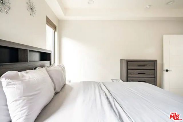 Bedroom #1 is furnished with a queen bed and dresser