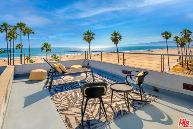 3007 Ocean Front Walk Venice, California Sitting on the famous Venice Beach Boardwalk, this stunning 3 bedroom, 3 bathroom condo is a beach lovers dream come true! The main floor boasts Fleetwood windows that completely open to allow for the full beach experience. Look out to the sand, the Venice Pier, the boardwalk, Malibu, and all the beauty of the Pacific Ocean. The main level features the kitchen, dining and living room as an open concept, perfect for entertaining. The kitchen has Viking appliances, and granite countertops. You'll also find an additional room which can be used as a bedroom, office, or playroom. A full bathroom, walk in pantry and ample closet space complete the first floor. An additional full bathroom is located outside. Fully enclosed and private, this bathroom is perfect when coming off the beach. On the second level is an oversized room and full bathroom. Currently this room is used as a guest room, office and exercise area. On the third level, you'll find the ultra-private primary suite, which boasts exceptional panoramic views of the ocean, providing a tranquil and serene atmosphere. The primary suite also includes a luxurious spa-like bathroom, ensuring a private and relaxing experience. One of the property's highlights is the two sun-drenched rooftops, which are perfect for both entertaining guests or just unwinding and enjoying the ocean and sand views. Additionally, this building has a 2 garage with one spot for each resident and 2 guest spots. Air conditioning, Casablanca ceiling fans, ample storage options, a laundry room and 3 stop elevator. Overall, this unit offers a perfect blend of modern design, picturesque ocean views, and easy beach access, making it an ideal choice for anyone looking for a luxurious coastal living experience, just steps to the coolest shops, eateries, surf and sand!