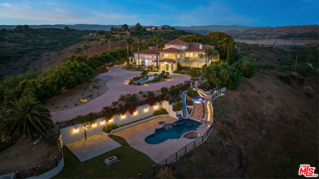 Situated atop a sprawling 20 acre lot, this magnificent estate is perched on a private hill within the highly sought-after gated community of Lexington Hills. The community is renowned for its exceptional education opportunities, being part of an award-winning school district. As you approach the estate, you'll be greeted by a private, gated entrance leading to a long, winding driveway that leads to your very own serene oasis. The estate's elevated position provides uninterrupted 360-degree views of the surrounding landscape, making it a truly breathtaking sight to behold. This residence has undergone significant renovation, including the installation of a new wifi tower to provide high-speed internet, generators, and a complete water filtration system. Spread across two floors, the property offers more than 11,000 square feet of lavish living space. The property boasts eight ensuite bedrooms and ten bathrooms, each designed with intricate attention to detail, to ensure maximum comfort and relaxation. The pool area is a true work of art, showcasing a pool, two hot tubs, a waterfall, a water slide, and a swim-up bar, creating an ideal setting for hosting unforgettable events and entertaining guests. Whether you enjoy hiking, horseback riding, or simply relaxing in the serenity of your private retreat, this property has it all. Don't miss the opportunity to own this exceptional estate and create unforgettable memories.