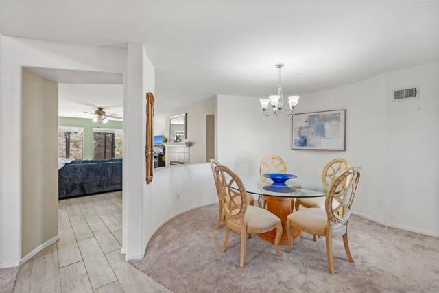 This dining room is open to the entrance to greet family and friends coming over for dinner and leaves an a opening  to engage in conversation in the family room and kitchen area as well. Very open floor plan!