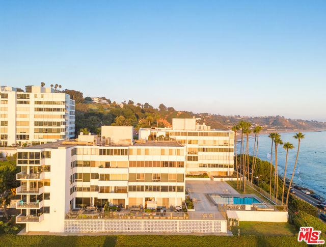 17368 W Sunset Boulevard 302A Pacific Palisades, California Boasting panoramic views of the Pacific Ocean, this corner unit in the Avalon building of the private and gated Edgewater Tower community is an amazing remodel opportunity. There are 2 bedrooms, 2 bathrooms, and a large living area with a decorative fireplace. The living room flows out to a private terrace, offering expansive ocean views. With views from almost every room, you will have a front row seat each night to the unparalleled California sunset. Set on 9 acres of beautifully manicured grounds, Edgewater Towers offers an unbeatable list of amenities, including guard gated security, 2 in-ground saltwater pools and jacuzzi spa that overlook the ocean, tennis and basketball court, full gym, and multiple entertaining areas including a barbecue area and gazebo with unwavering ocean views.